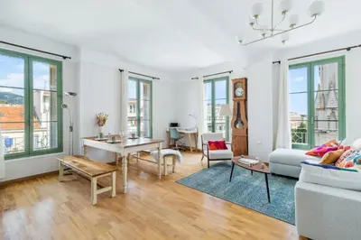 a living room with a couch and a table at Happyfew Cathedrale in Nice