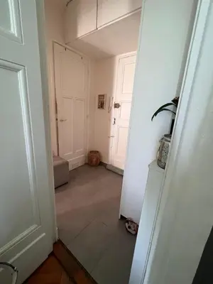a hallway with white walls and a white door at Lovely apartment nice in Nice