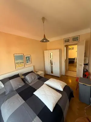 a bedroom with two beds in a room at Charming Riviera Top-Floor Apartment near the Beach in Nice