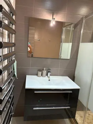 a bathroom with a white sink and a mirror at Elegant Apartment Terrace Port of Nice in Nice