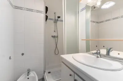 a bathroom with a shower and a sink and a toilet at HAPPYFEW Le Palais des Arts in Nice
