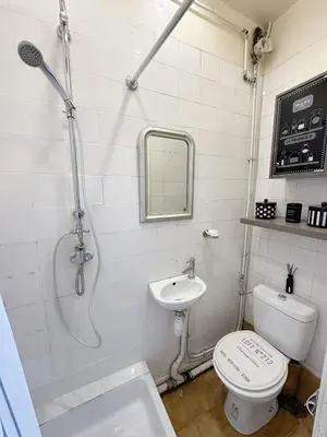 a bathroom with a shower and a toilet and a sink at Cosy appartement gare du sud - Nice - 3 guests in Nice