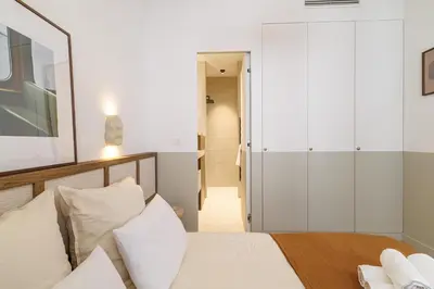a bedroom with a bed and a walk in closet at BERLIOZ - Splendid apartment in Nice city center in Nice