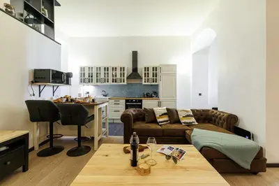 a living room with a couch and a table at MY CASA - STALINGRAD 24 - Cosy loft - Port in Nice