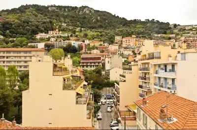 an aerial view of a city with buildings at Studio climatisé au calme, terrasse vue colline in Nice