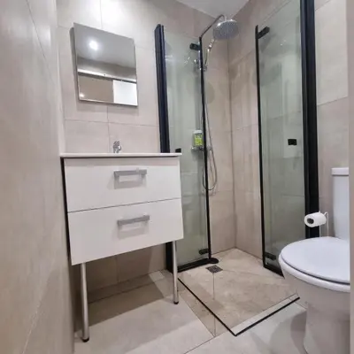 a bathroom with a sink and a shower at Spacious studio full of charm, recently updated in Nice
