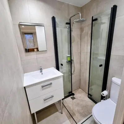 a bathroom with a shower and a sink and a toilet at Spacious studio full of charm, recently updated in Nice