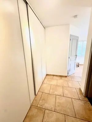 an empty room with a tiled floor and white walls at DOMAINE LOU BEL AZUR - Paisible in Saint-Laurent-du-Var