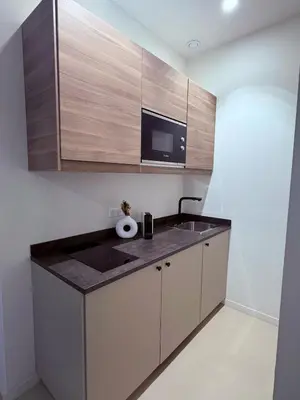 a kitchen with a counter top and a microwave at Studio cosy Le Vismara in Nice