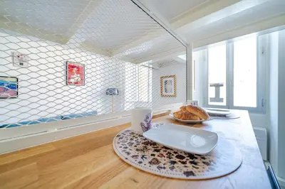 a room with a table with a plate of bread on it at Loft hyper-centre de Nice in Nice