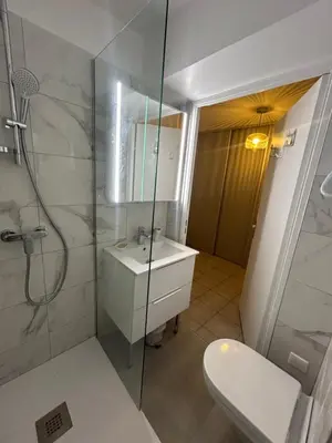 a bathroom with a shower and a sink and a toilet at Appartement cosy à 200 m de la mer in Cagnes-sur-Mer