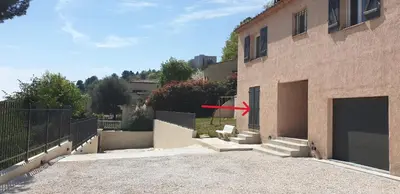 a red arrow is pointing at a building at Saint-Jeannet Studio apartment near Nice in Saint-Jeannet