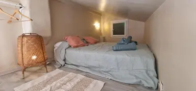a bedroom with a bed with pillows on it at Sunset Villa atypical with air conditioning in Nice