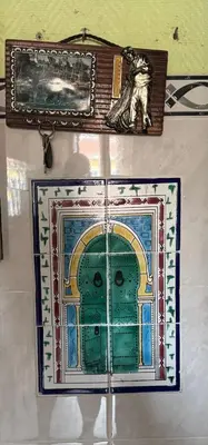 a painting of a door on a wall at Daghsen in Nice