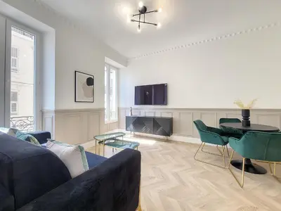a living room with a couch and a table at Nestor&Jeeves - EMERAUDE - Central - Modern in Nice
