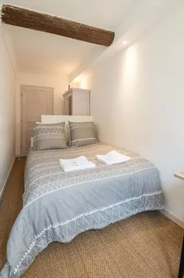 a bedroom with a bed with two towels on it at 
