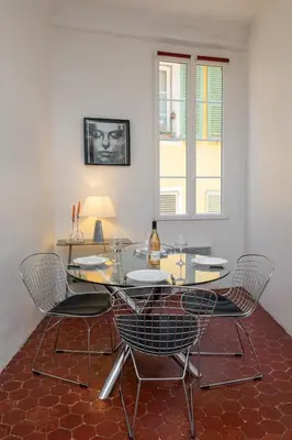 a dining room with a glass table and chairs at 