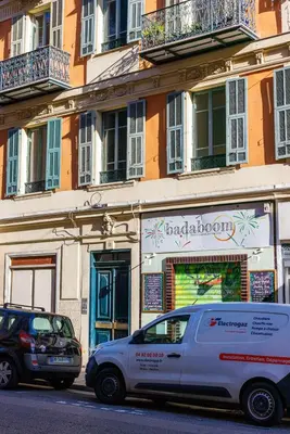 a white van parked in front of a building at Charmant studio refait à neuf quartier du port in Nice