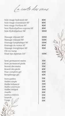 a white menu with a price list with flowers at Maison Lou in Falicon