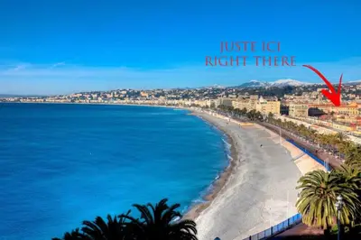 a view of a beach with a red arrow saying justice lick right there at L'Opéra - Hypercentre - Cosy - No elevator - Minimalist - Sea in Nice