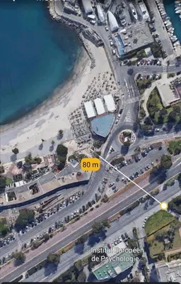 an overhead view of a parking lot next to a beach at Studio calme proximité plage in Saint-Laurent-du-Var