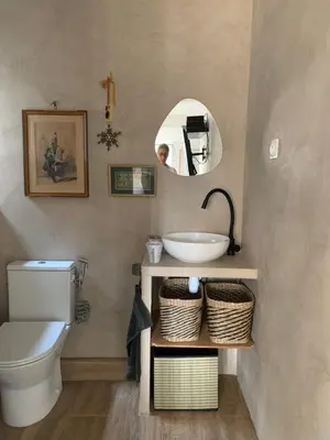 a bathroom with a sink and a toilet and a mirror at Grand studio Zen à côté de la promenade des Anglais in Nice