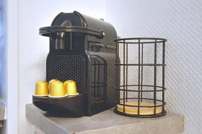 a shelf with two bird cages on top of it at Nouveau charmant Studio à 5 Minutes de la mer in Nice