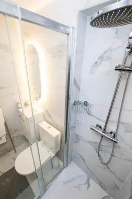 a bathroom with a shower and a toilet at Cozy studio in Nice Désambrois in Nice