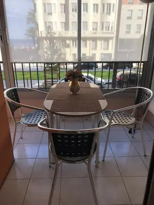 a table and chairs in front of a window at Spacious 2 BR 1 block from beaches - and the TRAM in Nice