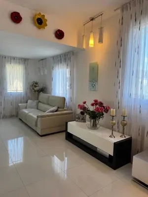 a living room with a couch and a table at Maison Ariana in Nice