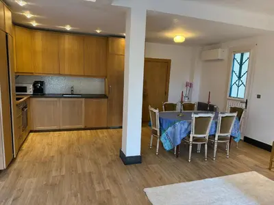 a kitchen and dining room with a table and chairs at Magnifique studio entier avec terrasse Saint Jean Cap Ferrat in Saint-Jean-Cap-Ferrat