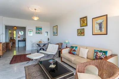 a living room with a couch and a table at ALTAIR AP4466 by RIVIERA HOLIDAY HOMES in Nice