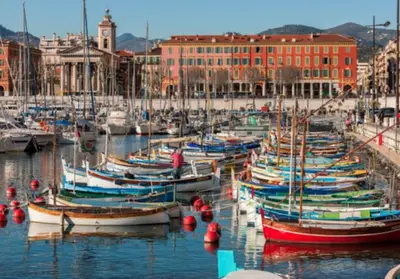 a bunch of boats are docked in a harbor at Cosy studio le port in Nice