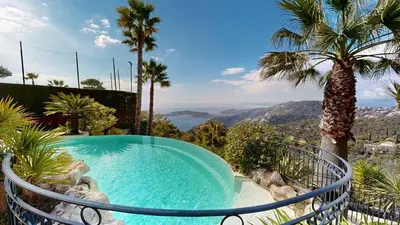 a swimming pool with a view of the mountains at Villa Ezea - vue mer et charme in Èze