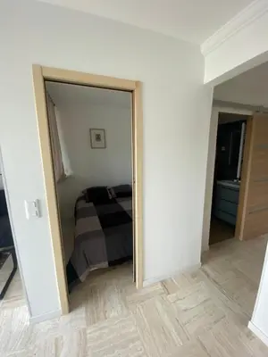 a bedroom with a door leading to a bed at Vacances à la mer in Cagnes-sur-Mer