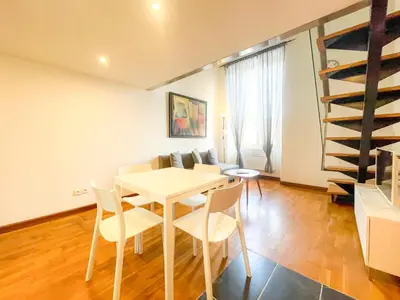 a kitchen and dining room with a table and chairs at Place Massena 4 Pers AC WiFi in Nice