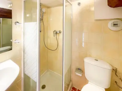 a bathroom with a shower and a toilet and a sink at Place Massena 4 Pers AC WiFi in Nice