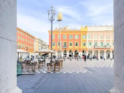 a city square with tables and chairs and buildings at Place Massena 4 Pers AC WiFi in Nice