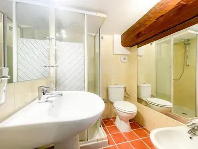 a bathroom with a white sink and a toilet at Place Massena 4 Pers AC WiFi in Nice