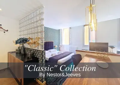 a bedroom with a bed and a desk in a room at Nestor&Jeeves - REFLET DOR - Vieux Nice - Near beach in Nice