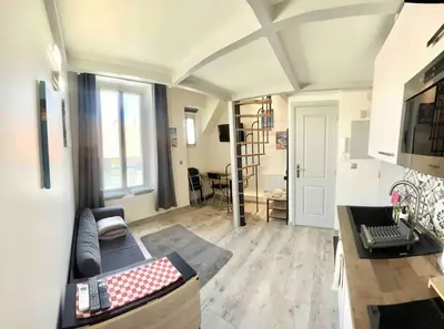 a living room with a couch and a table at Appartement moderne & calme proche mer et centre in Nice