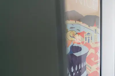 a painting of a city on a wall at Le Neoroch in Nice
