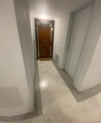 an empty hallway with a door in a building at Studio 112 in Nice
