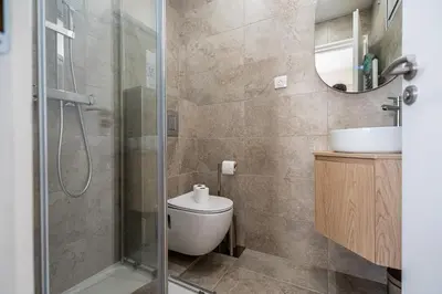 a bathroom with a shower and a toilet and a sink at L'Escale Niçoise in Nice