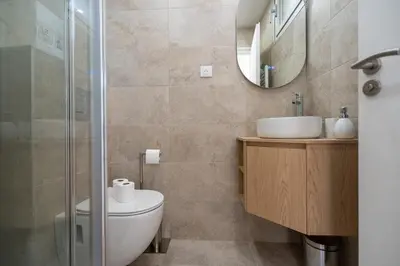 a bathroom with a toilet and a sink and a shower at L'Escale Niçoise in Nice
