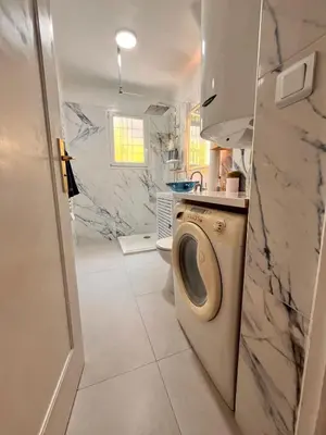 a bathroom with a toilet and a sink at Cosy appartement en plein centre-ville dans un halo de verdure avec vue mer in Nice