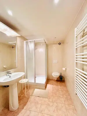 a bathroom with a sink and a shower and a toilet at Riviera Mornings - Old Town Stay - 5 Min to Beach & Breakfast in Villefranche-sur-Mer