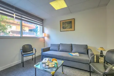 a living room with a couch and chairs at Castel du Port - Happy Rentals in Saint-Laurent-du-Var