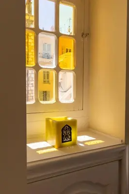 a yellow box sitting on top of a window at Le charme de l'ancien, rénové - Nice - 4 personnes in Nice
