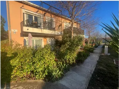 a building with a balcony and plants in front of it at Appartement 2 P calme in Cagnes-sur-Mer
